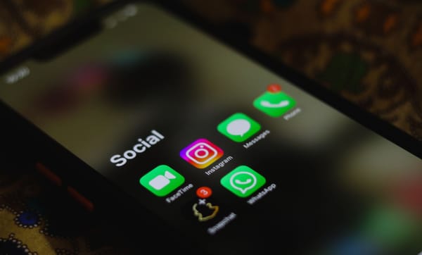 A smartphone screen showing a Social folder of apps